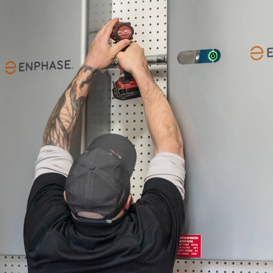 Home battery storage on a garage wall