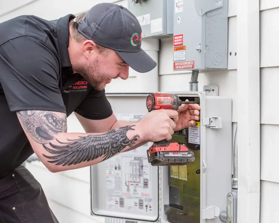 Licensed electrician working in an electrical panel