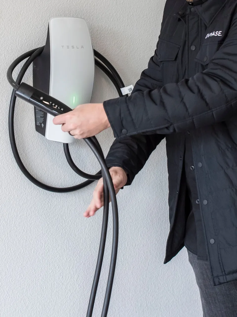 Wall-mounted home EV charger installed by Energy Solutions