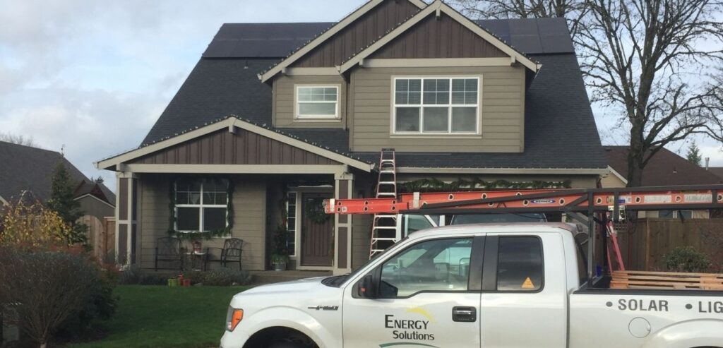 energy solutions of oregon truck in front of home roof solar panels