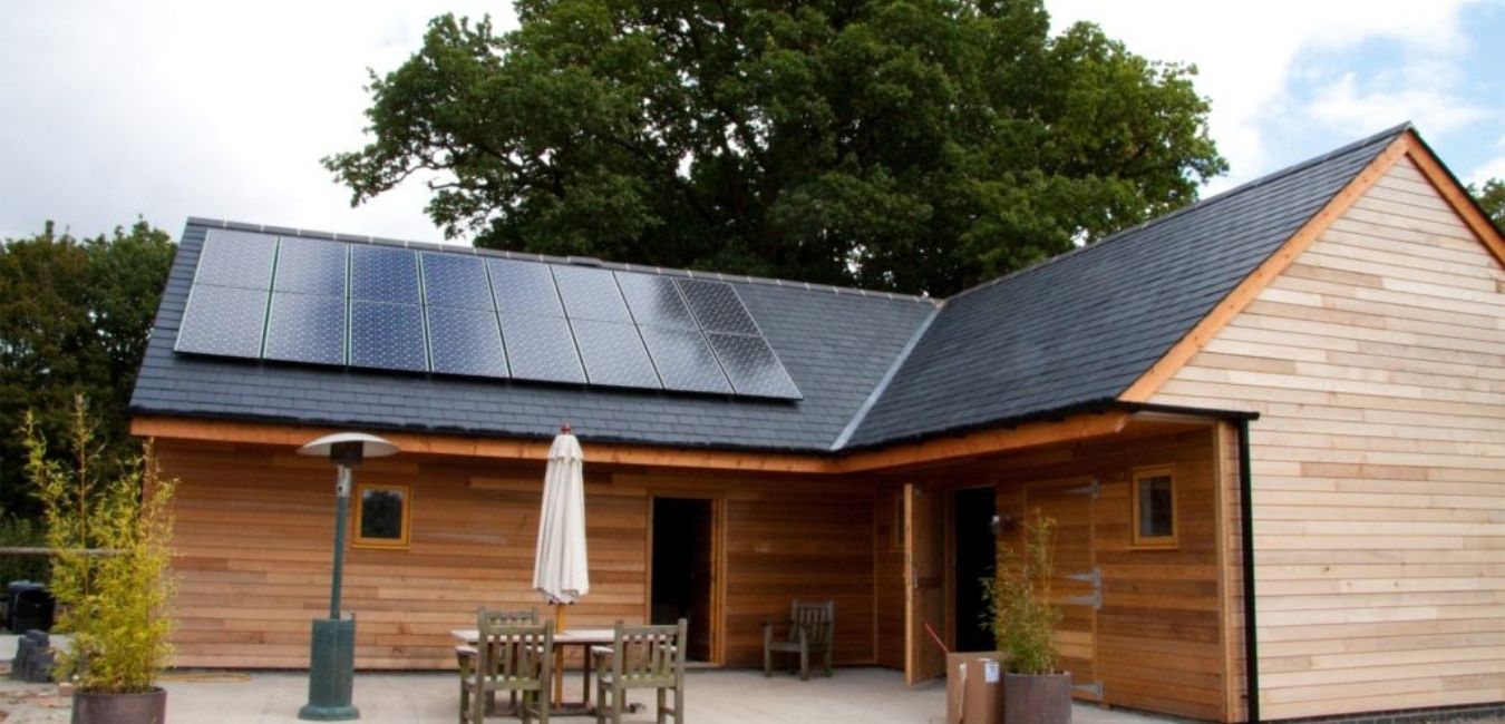 home roof solar panels on wood cabin in the Oregon forest