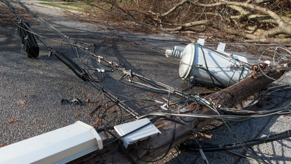 fallen utility pole after a storm