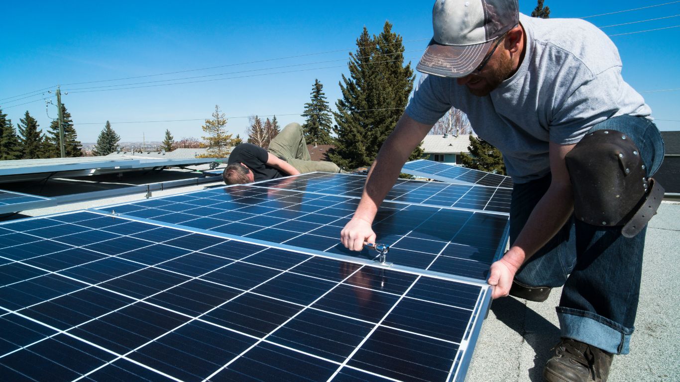 solar installer removing pv panels from roof