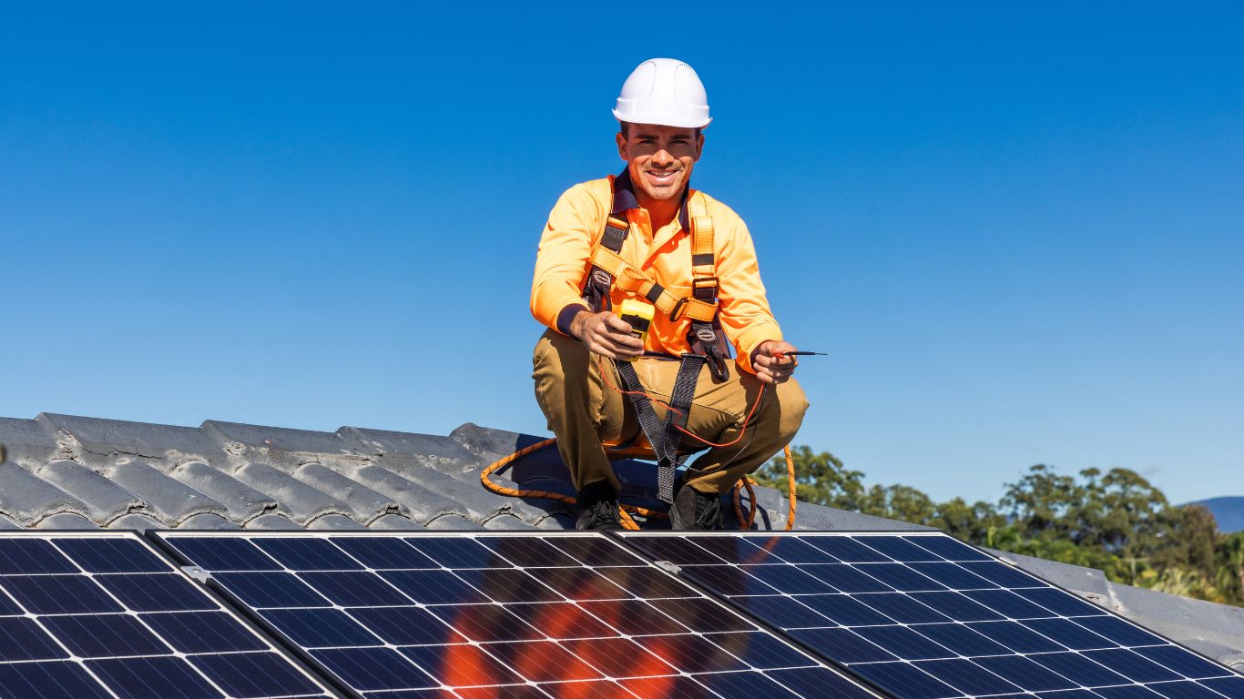 solar installer working on a solar panel installation