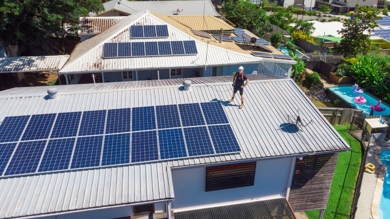 Portland solar installer standing next to a home solar system