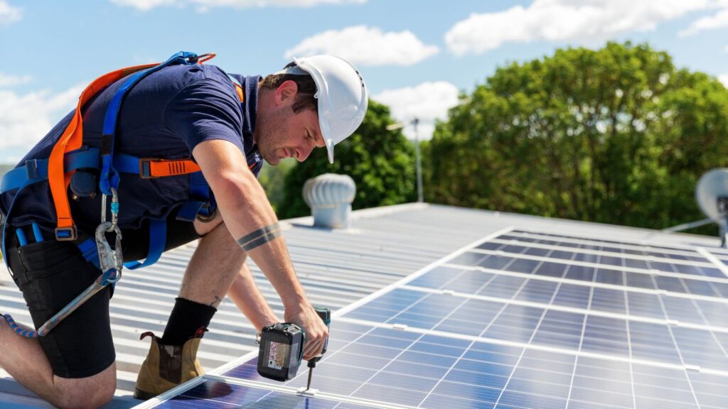 clackamas solar installer working on solar panels