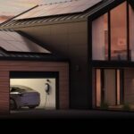 a modern house with solar panels on the roof and enphase ev charger in the garage