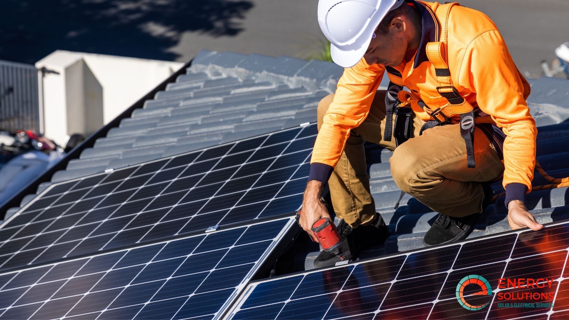 a person working on solar panels on a roof